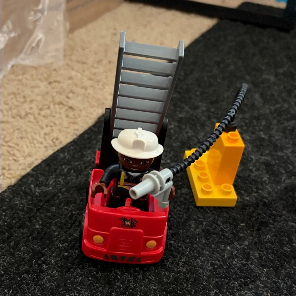 Lego Duplo Fire Truck With Firefighter Figure with fire hydrant and flame pieces